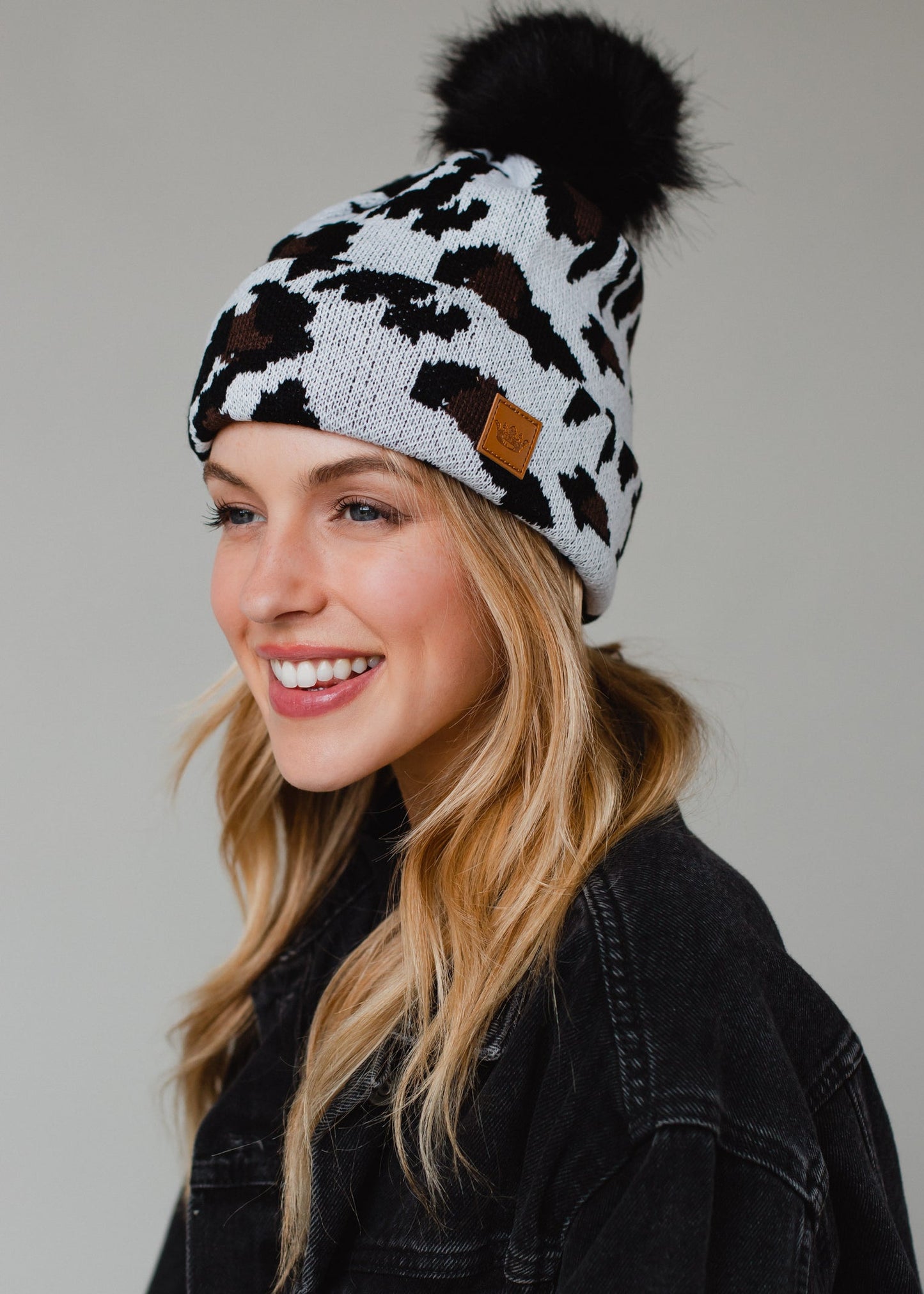 Trendy Fleece Lined Leopard Print Beanie with Faux Fur Pom